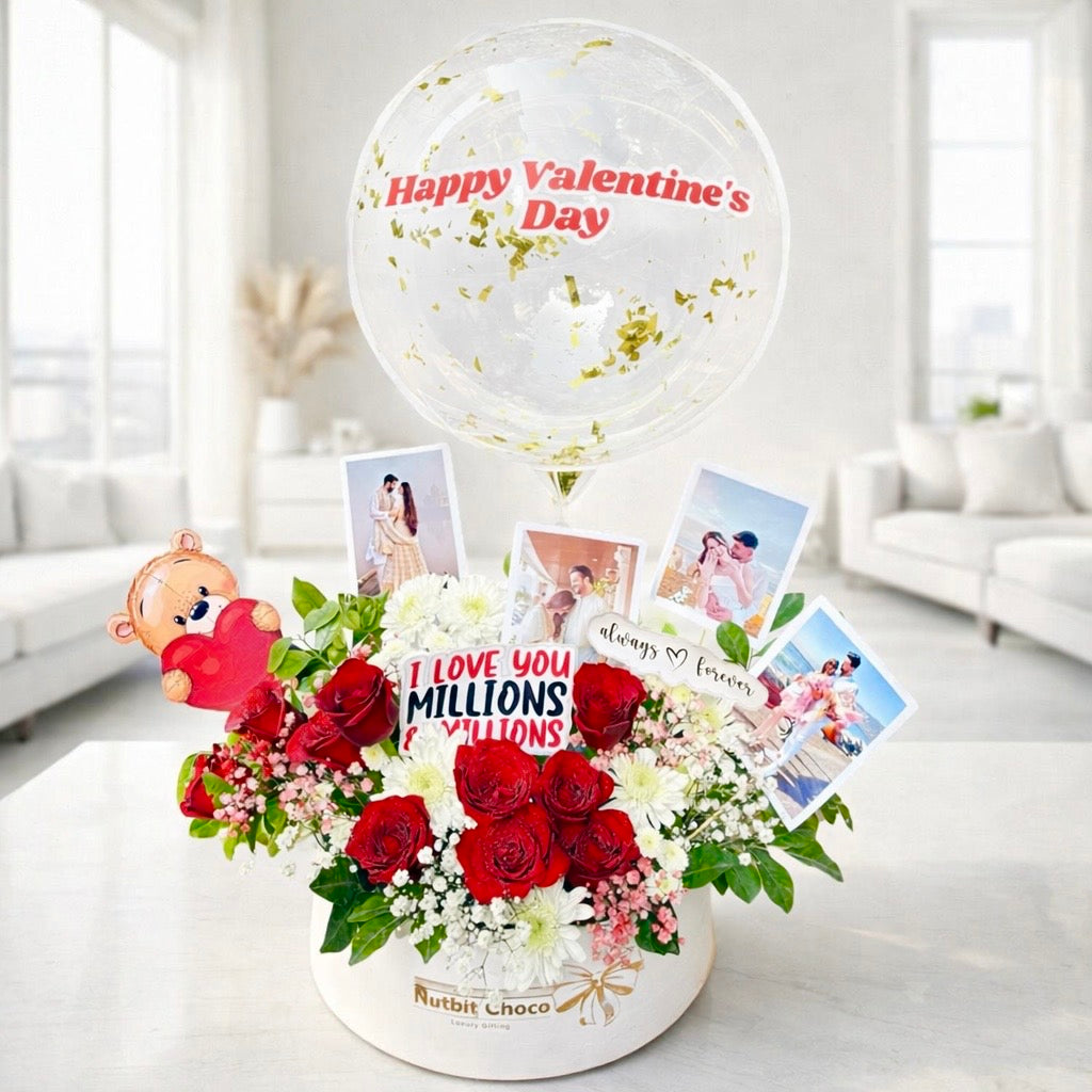 Valentine's Day arrangement with flowers, balloons, and photos in a modern living room.