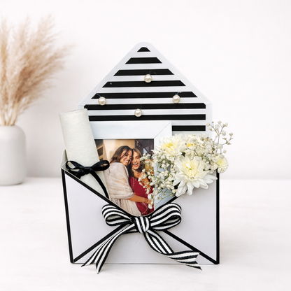 Decorative black and white striped frame with a photo and flowers on a white background