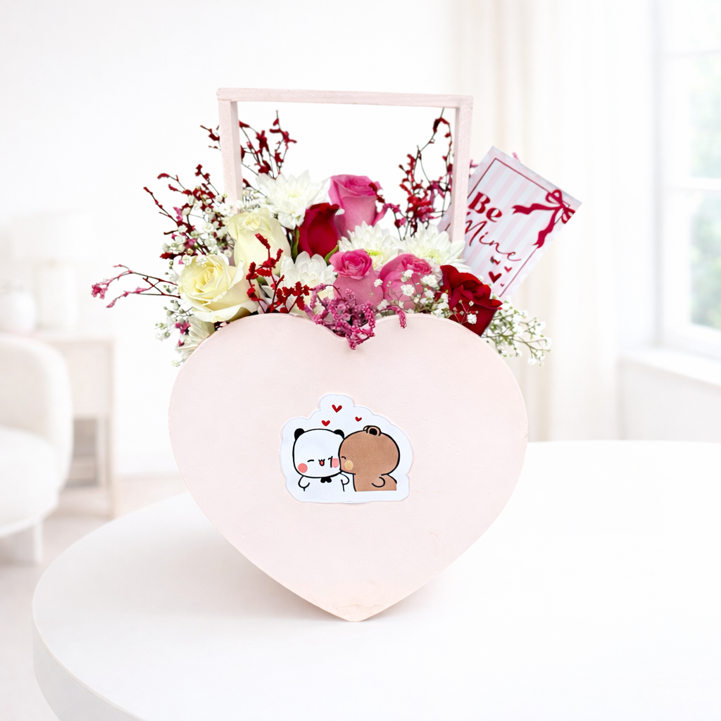 Heart-shaped box with flowers and a cute animal sticker on a white background