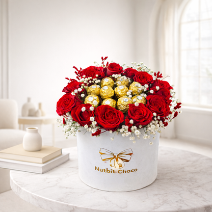 Bouquet of red roses and gold chocolate bars in a white box with 'Nutbit Choco' branding on a marble surface.