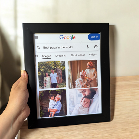 Digital photo frame displaying a Google search for 'Best papa in the world' with family images.