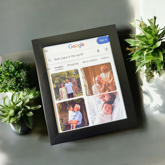 Digital photo frame displaying a Google search for 'Best papa in the world' with images of a family.