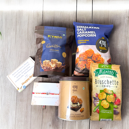 Assorted snack packages includingKYOMI, Himalayan Salt Caramel Popcorn, and Maretti Bruschette Chips on a wooden surface.
