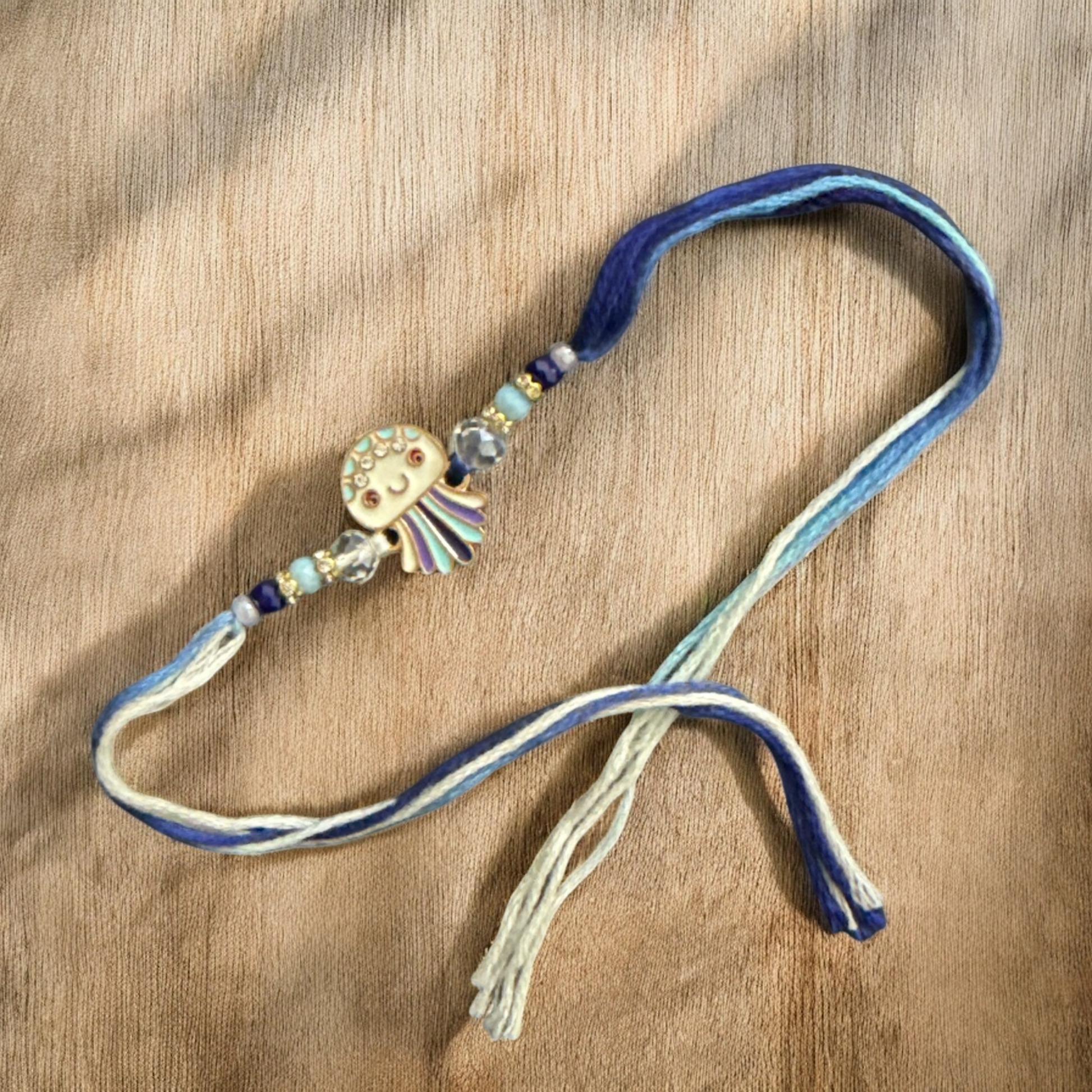 Decorative ribbon with a decorative clasp on a wooden surface